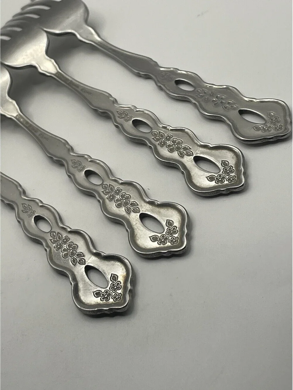 4- Oneida Community FANTASY Burnished Stainless Pierced Hndl Dinner Fork ~7.25”